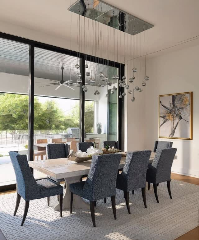 A modern cluster of glass globes floating at varying heights sets the soft glow for this breakfast nook. Paired with a light wood table and contrasting upholstered chairs, the look is clean, warm, and quietly luxurious—proof that understated design can still shine bright.Et Voilà. ✨Interior design by @designershannongidneyibb 📸 by @piassickphoto #teamIBB #IBBDesign #ModernSimplicity #QuietLuxury #BreakfastNook #DesignDetails #LuxuryInteriors #InteriorInspiration
